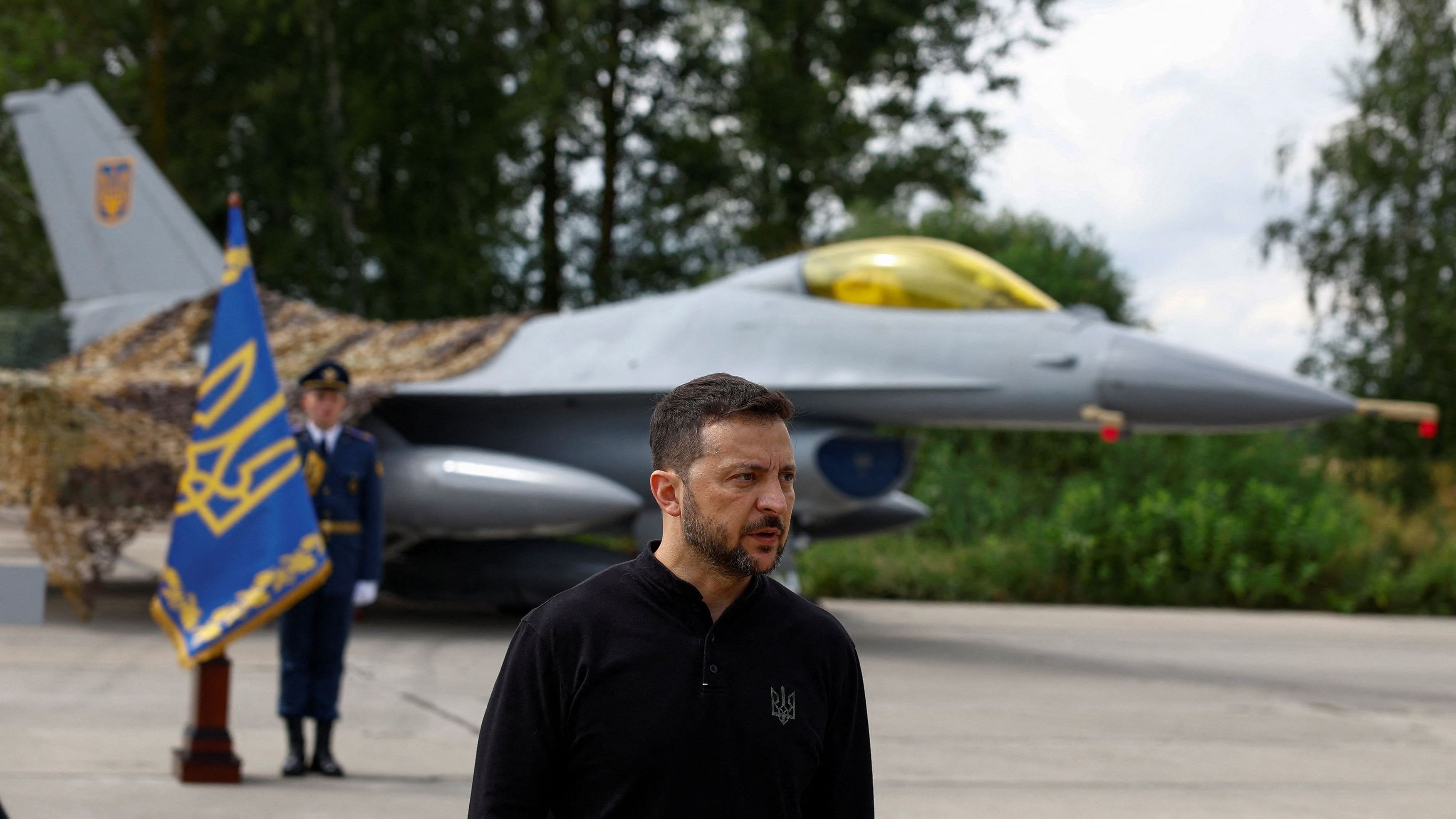 <div class="paragraphs"><p>Ukraine's President Zelenskiy speaks to the media in a front of an F-16 fighting aircraft after marking the Day of the Ukrainian Air Forces in an undisclosed location in Ukraine.</p></div>